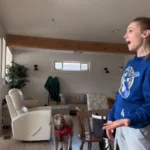 Woman Films Herself Singing, Spots Her Dog Doing Something Hilarious